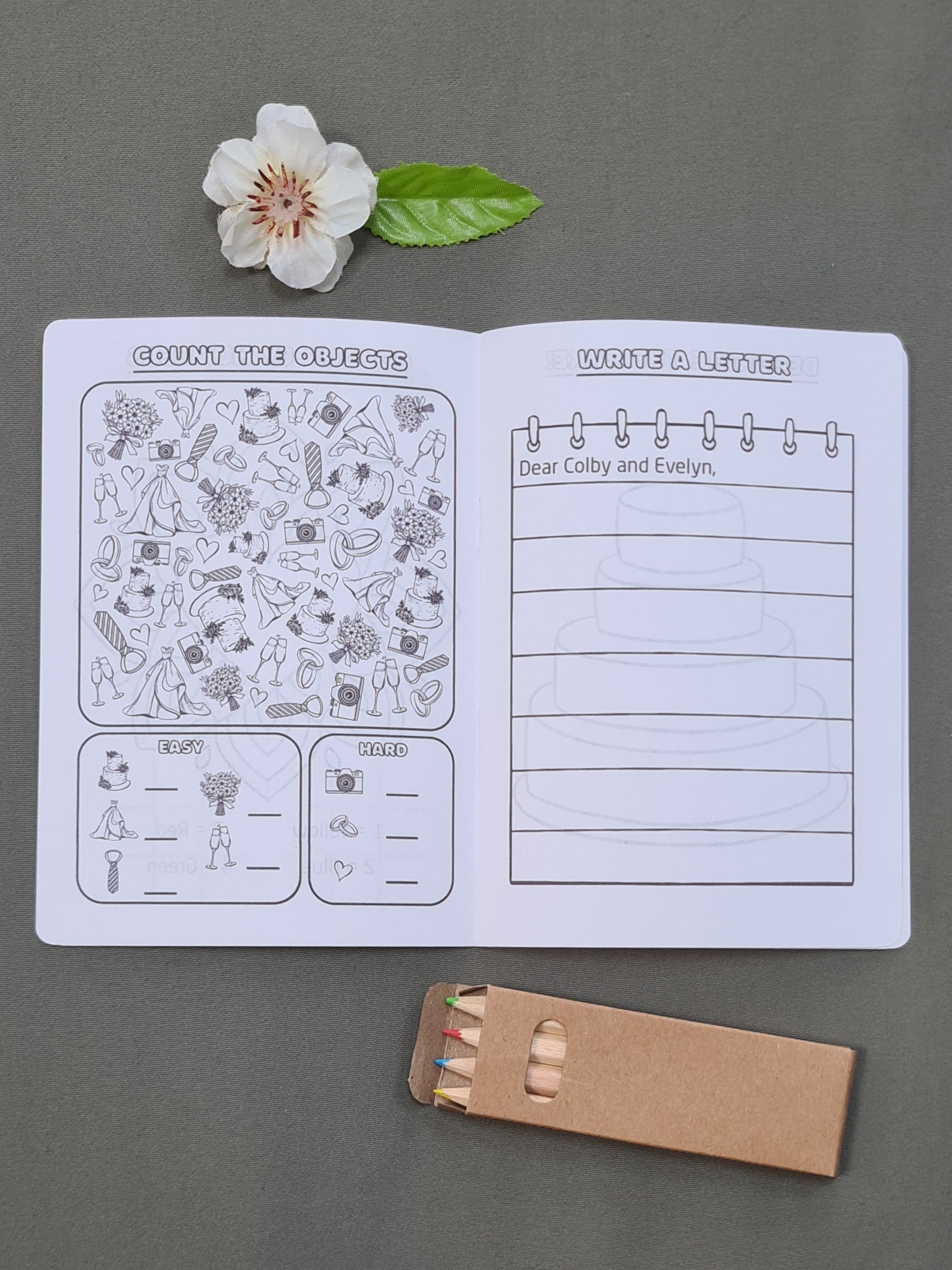 Inside pages of a personalised wedding activity booklet for kids, showing the 'Count the Objects' and 'Write a Letter' activities. Coloured pencils included.