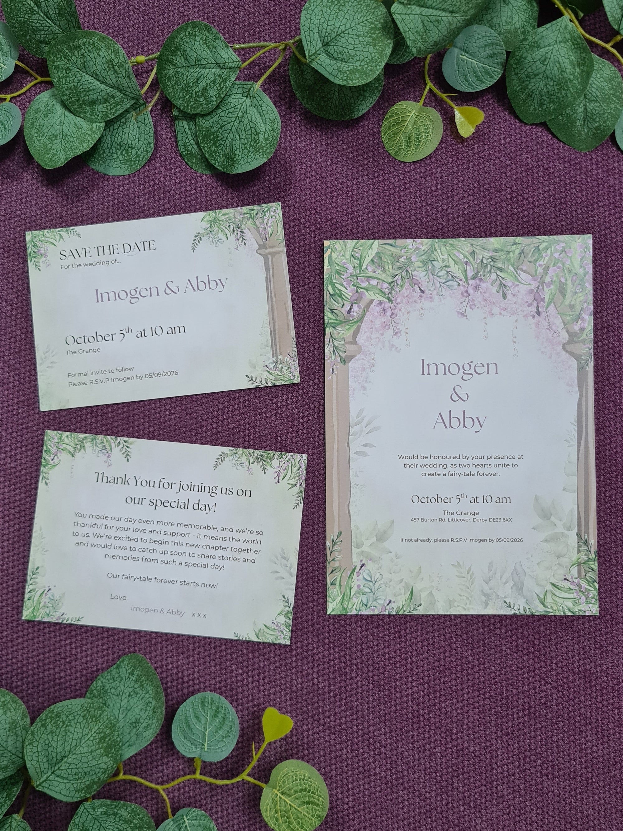 ALÈCLEE Designs - Wisteria Fairy-Tale Wedding Stationary Collection. Fairy-tale inspired wedding invitation featuring cascading wisteria, lush greenery, and elegant stone pillars, capturing a timeless romantic setting.
